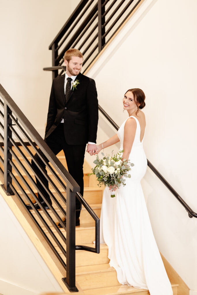bride and groom on stairs