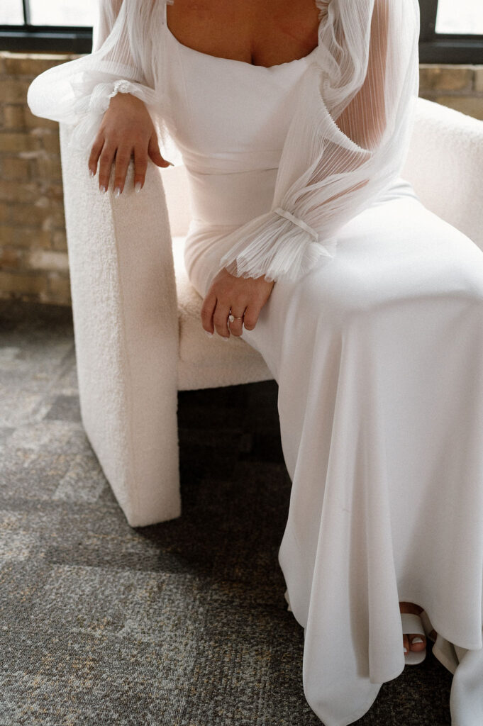 Bride sitting on chair at Harvester Square St Cloud Minnesota Wedding venue