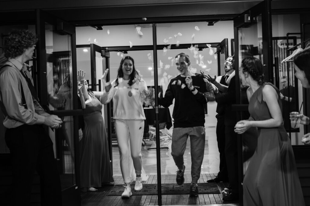 bride and groom grand exit at Reeds & Rushes