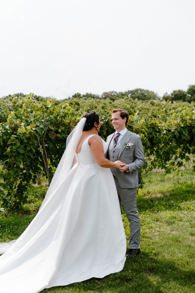 Bride and groom first look at 7 vines vineyard
