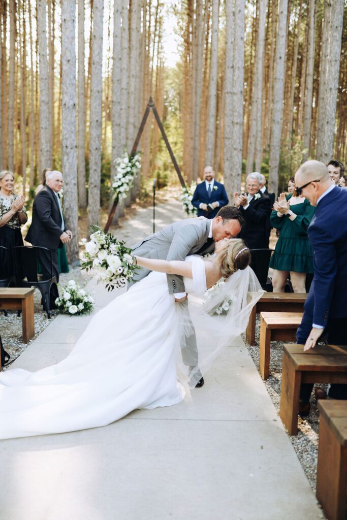 bride and groom kissing during ceremony