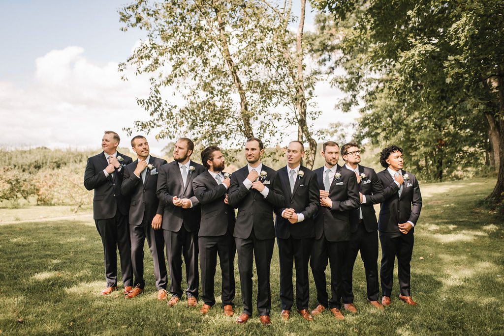 Groomsmen at Dixons Apple Orchard wedding venue in Eau Claire Wisconsin