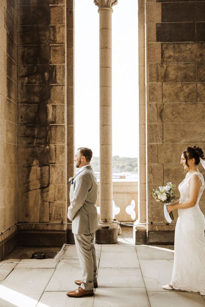 Bride and groom first look at Landmark Center in St Paul Minnesota