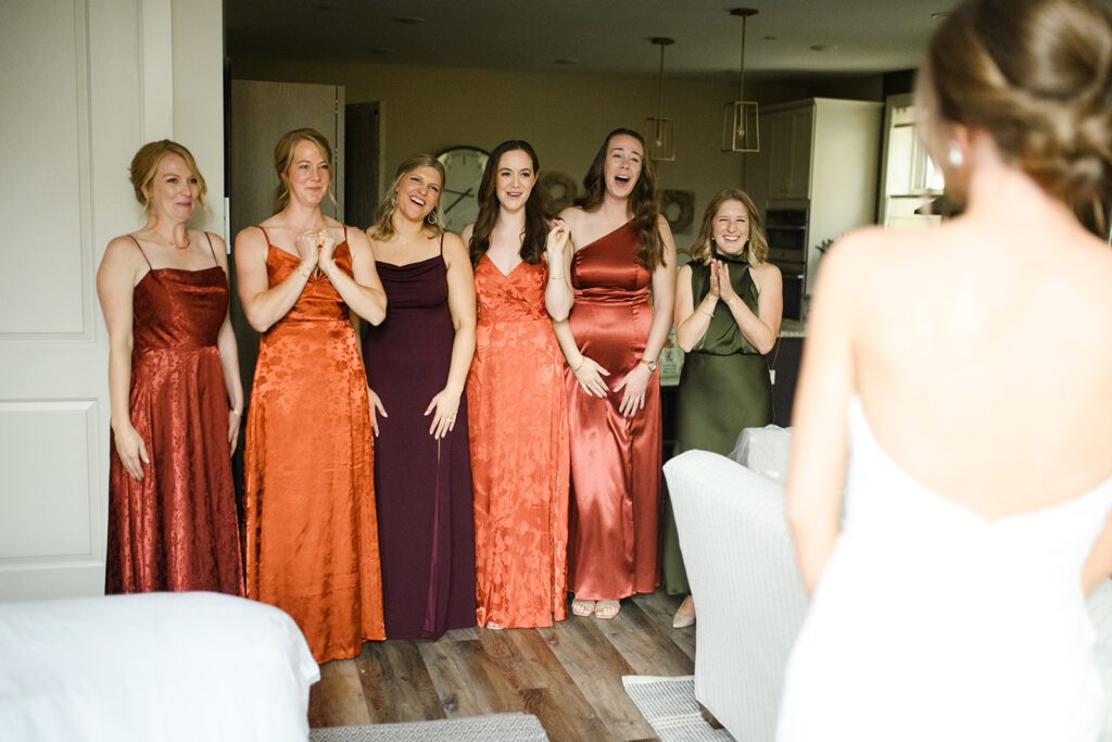 Bridesmaids first look at Camp Fire Minnesota wedding venue
