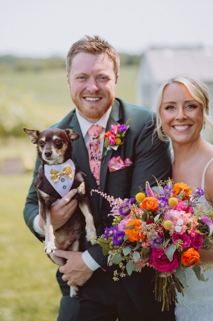 Bride groom and their dog at Pondview Farm wedding venue in Cambridge Minnesota