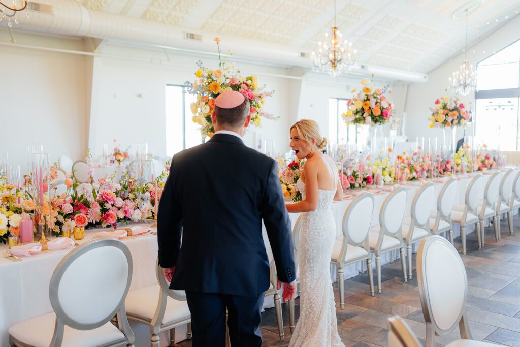 Bride and groom with colorful florals at Edward Anne Estate at Bavaria Downs
