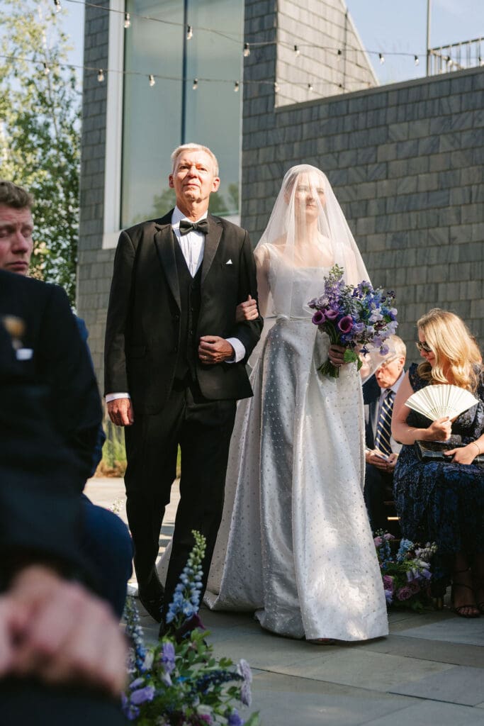 Bride and father walking down aisle at The American Swedish Institute in Minneapolis Minnesota
